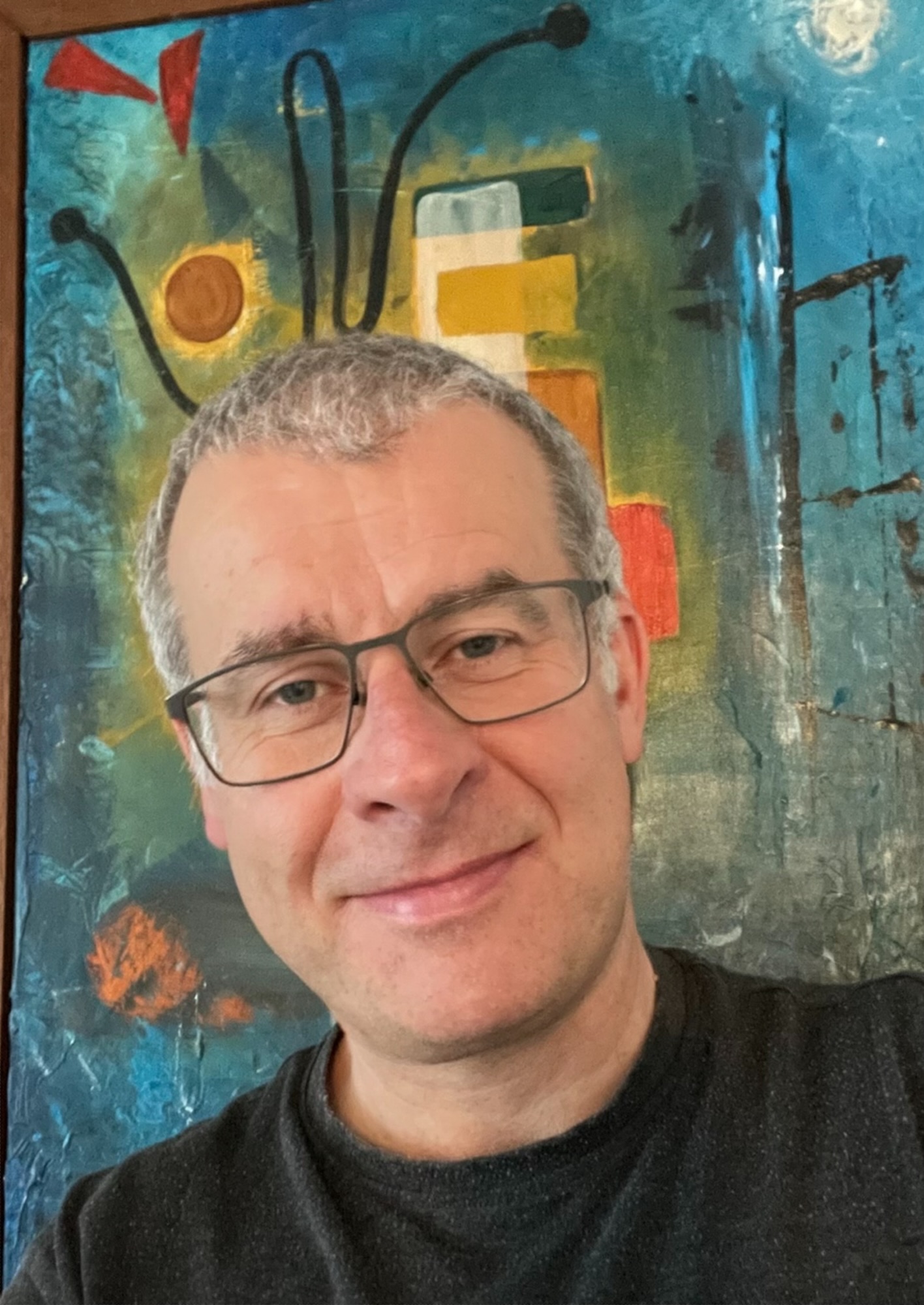Edward Torsney portrait photo with abstract painting